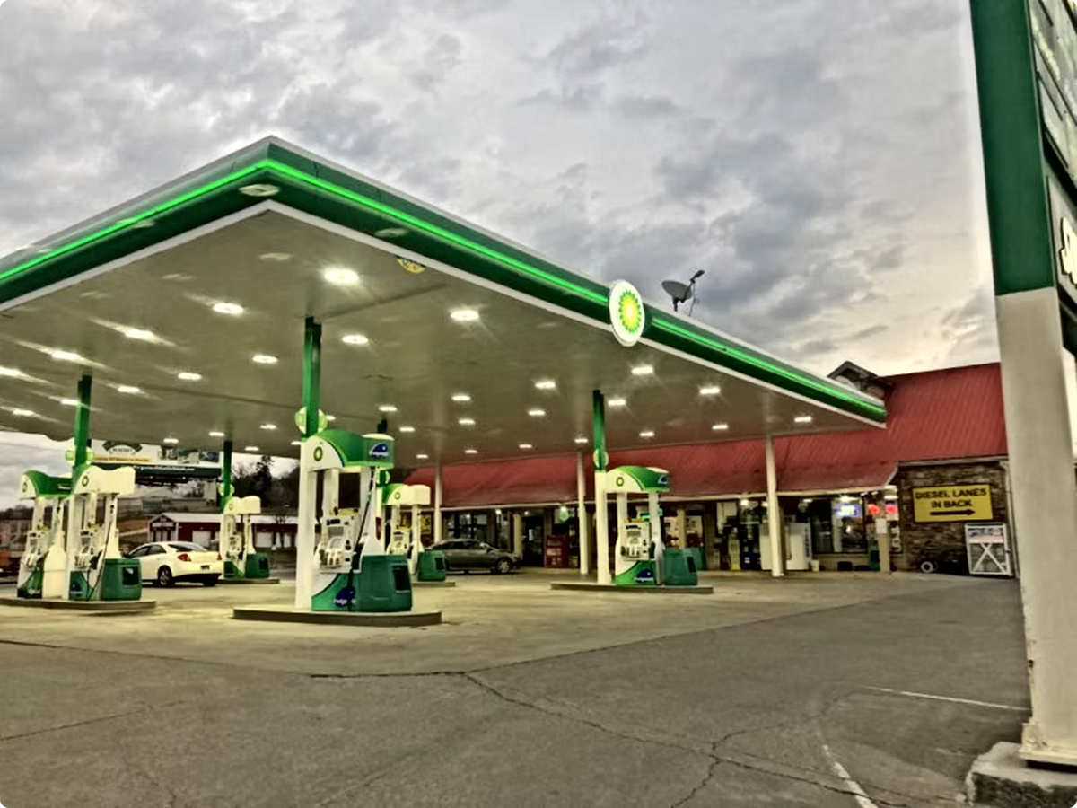 Gas station at dusk with cloudy sky