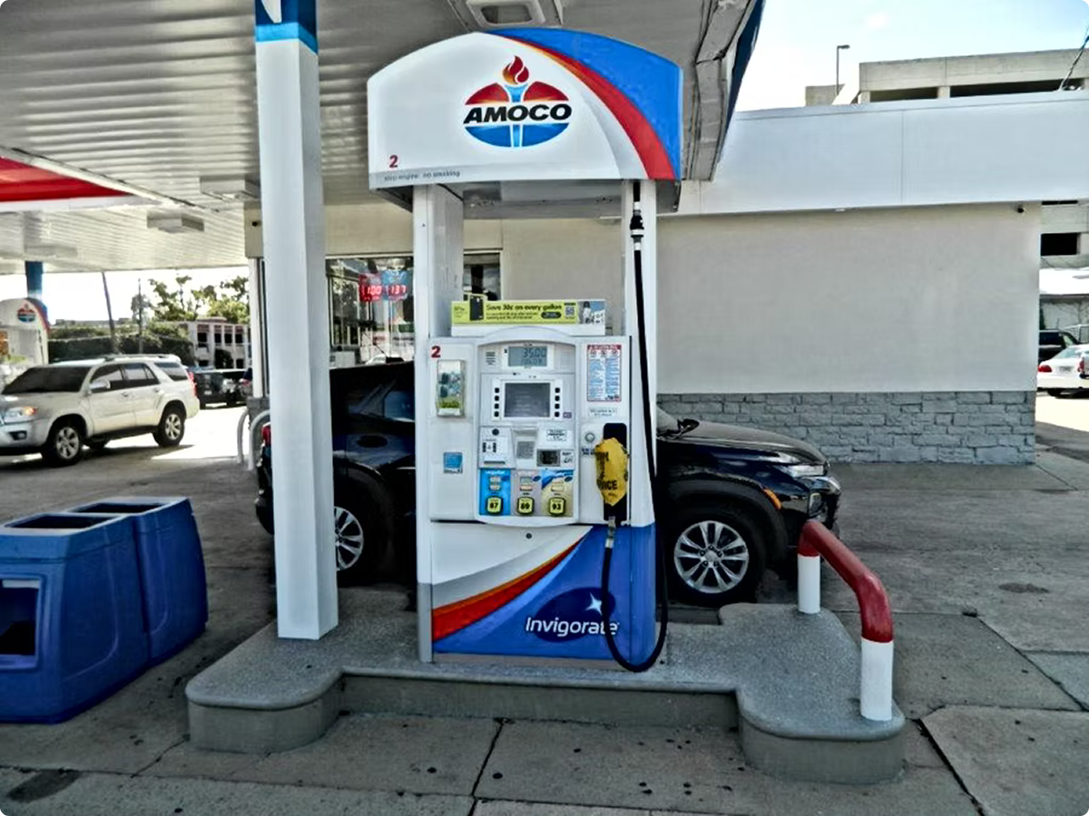 Cars refueling at Amoco gas pump